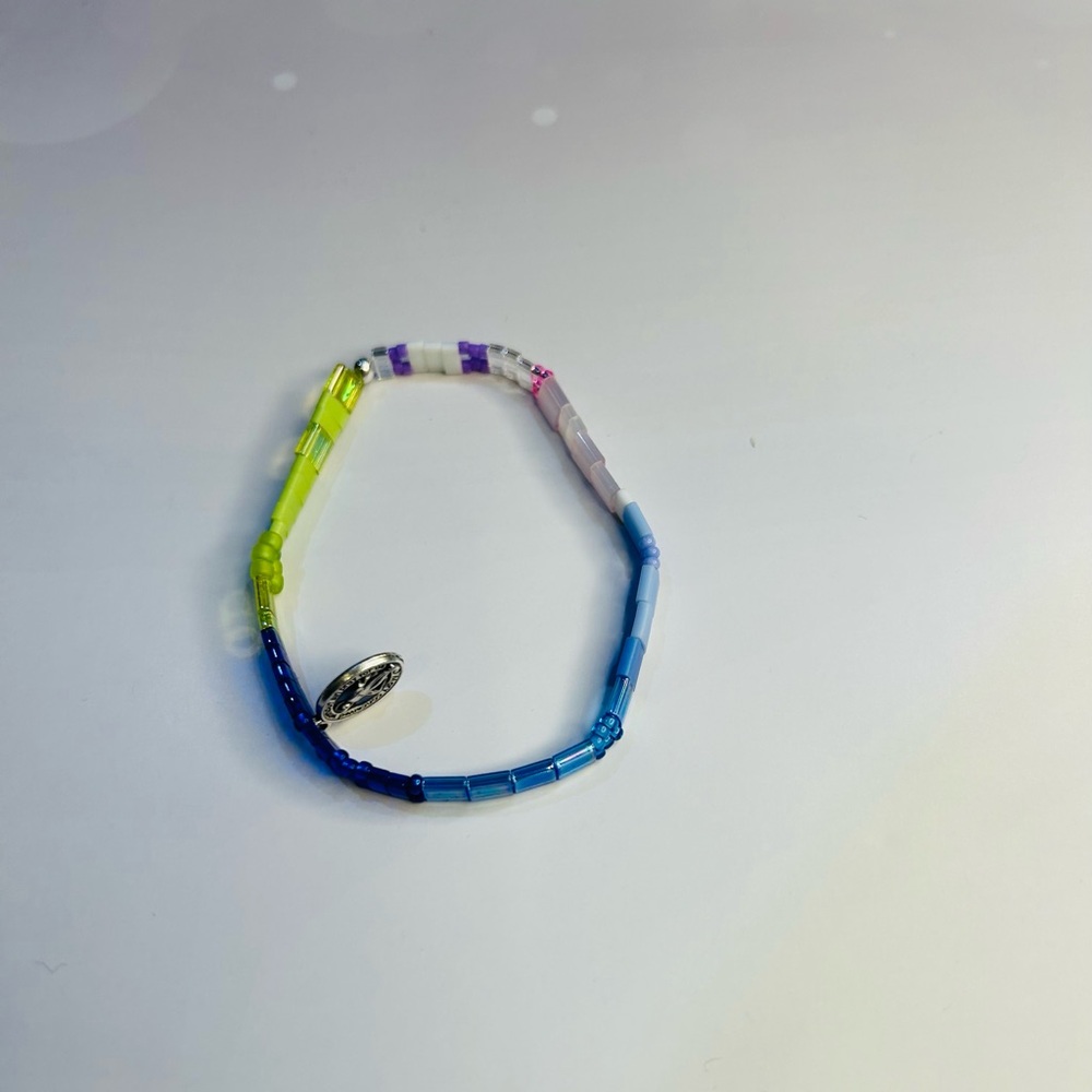 Bracelet made of Tila, Miyuki glass, bugle & seed beads & Virgin Mary charm.